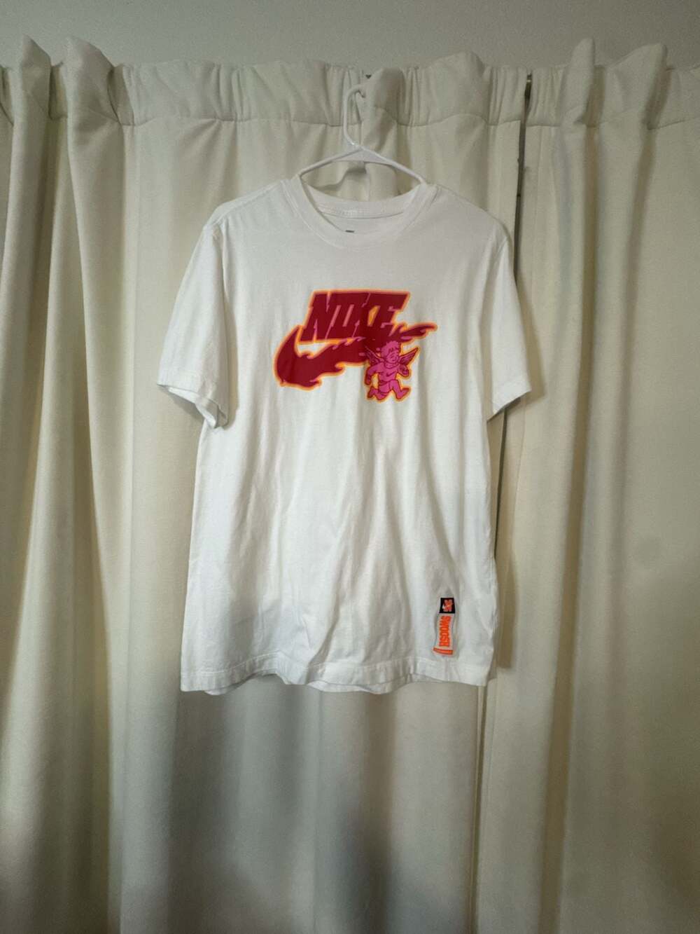 Nike Sportswear Men's White Graphic Tee with Cherub Swoosh Logo
